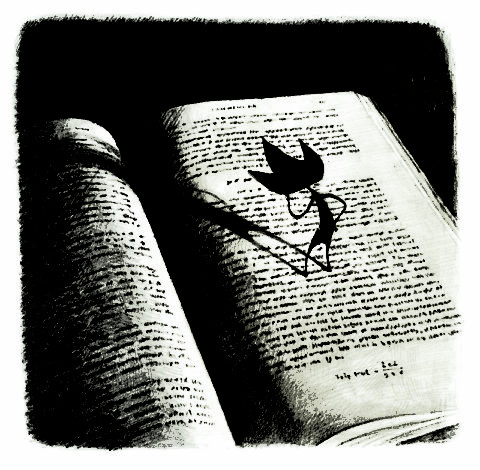 Eric A book lies open on a table. Standing on the pages of the book is a small black character with three points on its head.