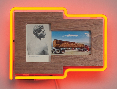 Photograph of indigenous man and logging truck within orange neon light