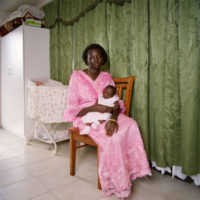 Sudanese mother nursing baby
