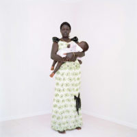 Sudanese mother and baby before white background