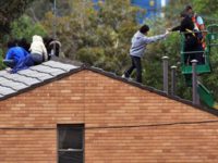 Photo of Villawood protestors on roof of detention centre