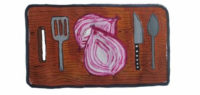 Halved red onion and cooking utensils on chopping board